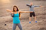 Couple working out with weights