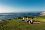 Women on cliff, meditating