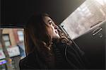 Young woman looking over her shoulder from taxi