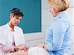 Doctor Examining Senior Patient in Doctor's Office