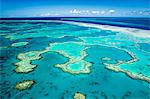 Australia, Queensland, Whitsundays, Great Barrier Reef Marine Park.  Aerial view of coral formations at Hardys Reef.