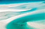 Australia, Queensland, Whitsundays, Whitsunday Island.  Aerial view of shifting sand banks and turquoise waters of Hill Inlet in Whitsunday Islands National Park.