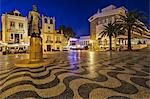 Statue of King Dom Pedro IV at twilight with traditional Portuguese paving on Praca 5 de Outubro (Town Hall Square) and the Hotel Baia to the right, Abuxarda, Cascais, Lisboa, Portugal.
