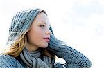 Pretty young woman wearing a scarf and looking away