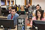 Students listening in their computer class in college