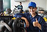 Happy trainee showing thumb up in workshop