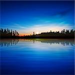 abstract blue background with sunrise and forest lake