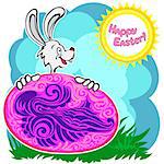 Bunny with patterned easter egg on a glade with clouds and sun