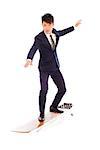 businessman practice surfing pose with suit