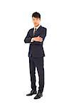 Confident businessman standing and  crossed arms