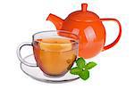 Glass cup of tea with mint leaves and orange teapot isolated on white background