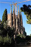 Facade of the Sagrada Familia near few construction cranes. Barcelona, Spain