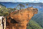 Hanging Rock in the Blue Mountains Australia.  You have to jump the crack at your own risk to gain access to this magnificent and narrow sandstone rock as it is detached from the main cliff