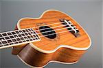 Close-up shot of classic ukulele guitar, selective focus on pattern