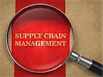 Supply Chain Management Concept. Text on Old Paper with Red Vertical Line Background through Magnifying Glass.