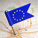 Small Flag of European Union on a Map Background with Selective Focus.