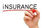 Hand underlining Insurance with red marker on transparent wipe board.