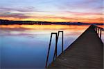 Sundown colours of the sky and water reflections at Long Jetty, Tuggerah Lakes NSW Australia