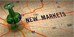 New Markets Concept - Green Pushpin on a Map Background with Selective Focus.