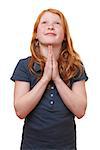 Portrait of a praying young girl on white background