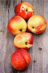 Heap of Perfect Ripe Nectarines In a Row on Rustic Wooden background. Top View