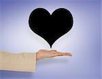 Female hand presenting heart against purple vignette