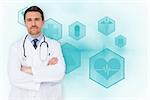 Handsome young doctor with arms crossed against blue medical interface with icons