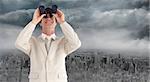 Composite image of confident businessman with binoculars against gloomy city