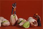 Miniature Construction Workers in Conceptual Food Imagery With Pistachio Nuts