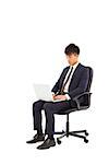 businessman using laptop on the chair