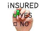 Hand putting check mark with green marker on Yes Insured.