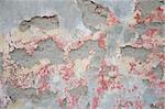Texture of old wall with gray, red crumbling plaster