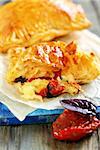 Puff pastry with cheese, sun-dried tomatoes with basil.