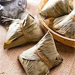 Traditional steamed sticky glutinous rice dumplings. Hot rice dumpling or zongzi. Chinese food dim sum. Asian cuisine.