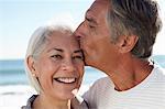 Man kissing woman on forehead