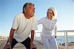 Couple doing squatting exercise