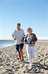 Couple jogging on beach