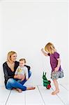 Studio shot of mother and two young daughters