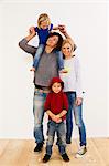 Studio portrait of couple together with son and daughter