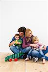 Studio shot of couple with two young daughters