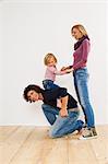 Studio shot of couple with young daughter