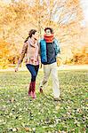 Couple walking in park