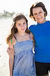 Mother with teenage daughter on beach