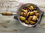 Sauteed chicken breast with potatoes,lemons and olives