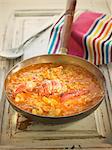 Rice in tomato sauce with lobster,squid and hake