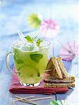 Mojito without alcohol and goat's cheese and Parma ham mini sandwiches