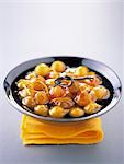 Stewed mirabelle plums with vanilla and orange zests