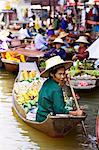 Fruit seller in the Damnern Saduak floating market, Bangkok, Thailand