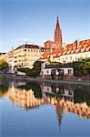 Buildings reflected in the River Ill, Strasbourg, Bas-Rhin, Alsace, France, Europe