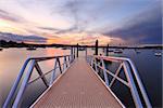 Sundown at Saratoga with the new jetty wharf and pontoon in the foreground.  Some of the boats have motion.  Long exposure.